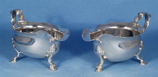 A pair of George II silver sauce boats, attributed to Joseph Sanders, length 195mm, weight 24.4 oz/760grms.